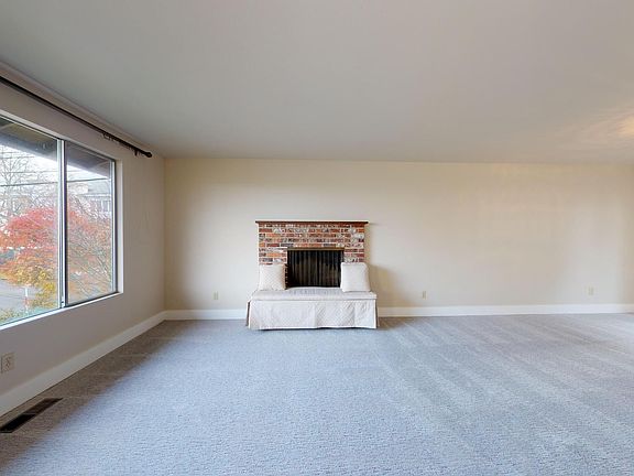 Living room as you walk up the stairs from entry.
