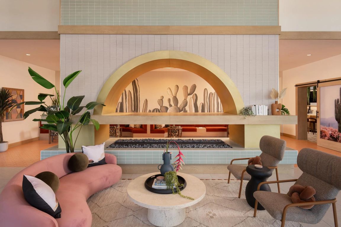 A statement lobby with desert tones, layered lighting, and inviting seating_welcome home to Modera Rio Salado.