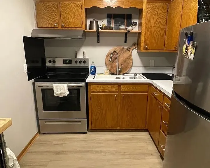 Revitalize your culinary experience in this modern kitchen featuring sleek stainless-steel appliances and ample storage space. Perfect for culinary enthusiasts and everyday cooks alike. Explore LS Capital Group and elevate your lifestyle today!