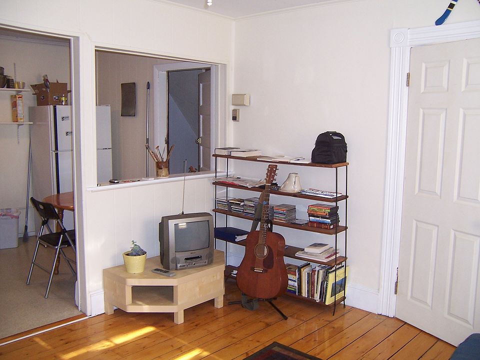 View from Living Room into Kitchen. Wall color is light grey.