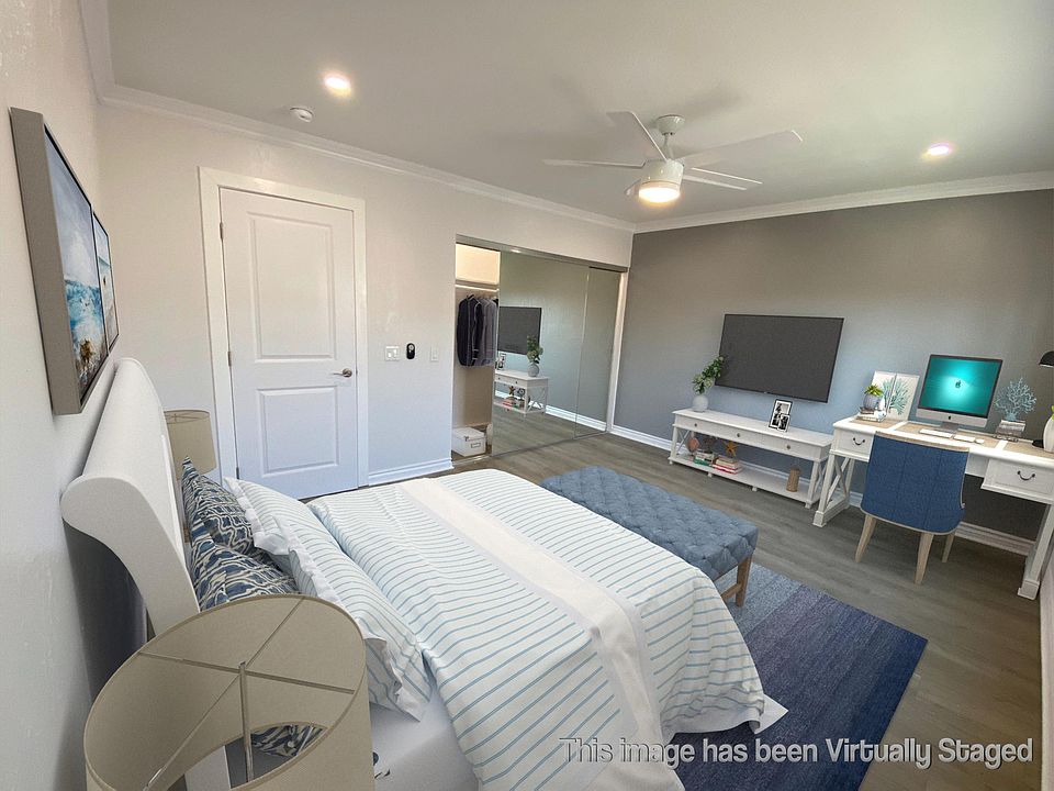 Bedroom #1 with mirrored closet door and large window