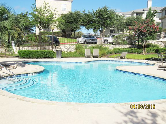 community pool with charcoal grill