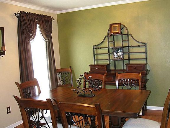 Formal dining is just off the entry with windows looking onto the front yard