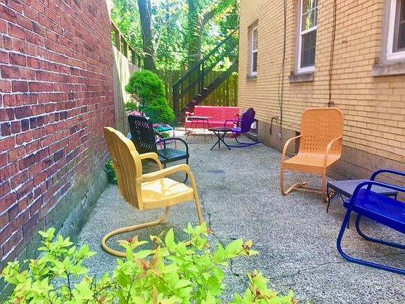 Vintage patio furniture in a charming gated courtyard!