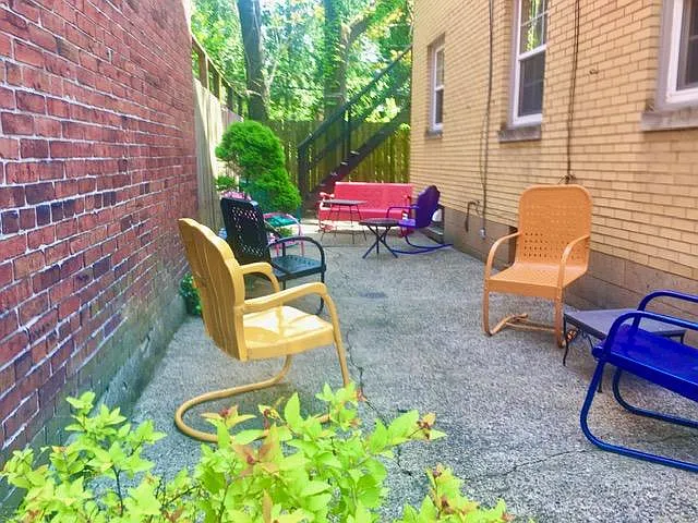 Vintage patio furniture in a charming gated courtyard!