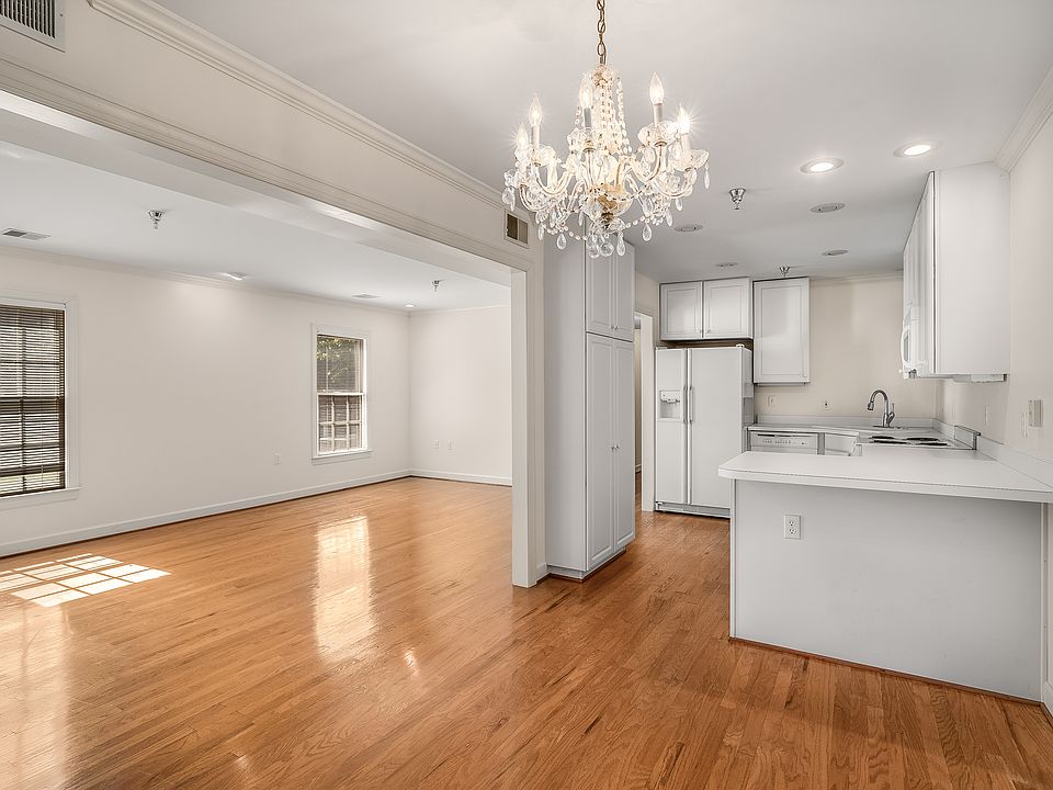 Dining room opens into living room and kitchen.
