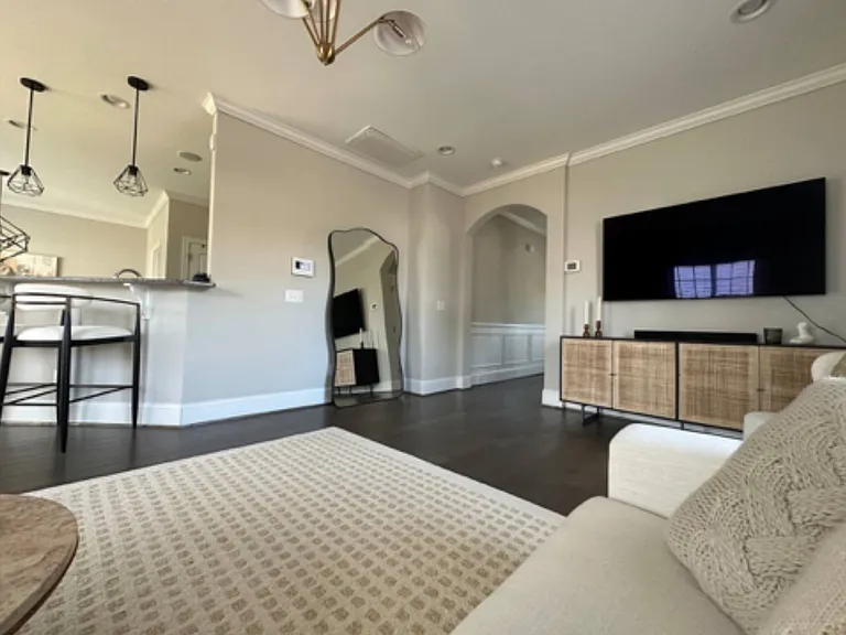 Open concept living room with view of kitchen for entertaining