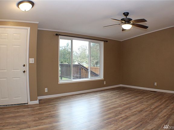 Large picture window brings in an abundance of natural light in the front living room