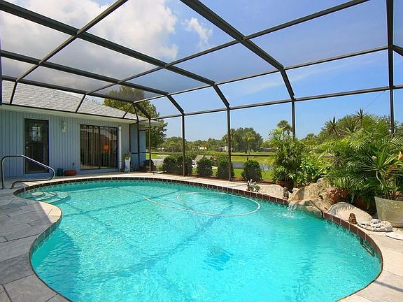 Caged pool area overlooking 16th fairway of the golf course