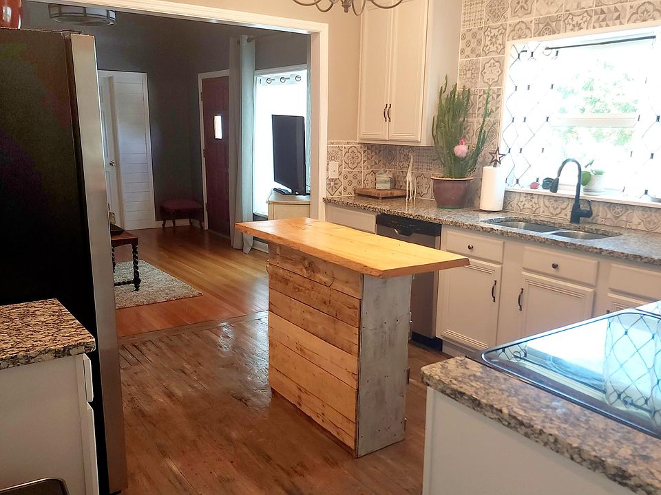 Kitchen viewed from the dining room. Even the movable island has a rustic feel