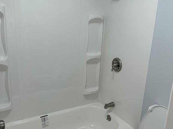 Shower and tub area of upstairs bathroom