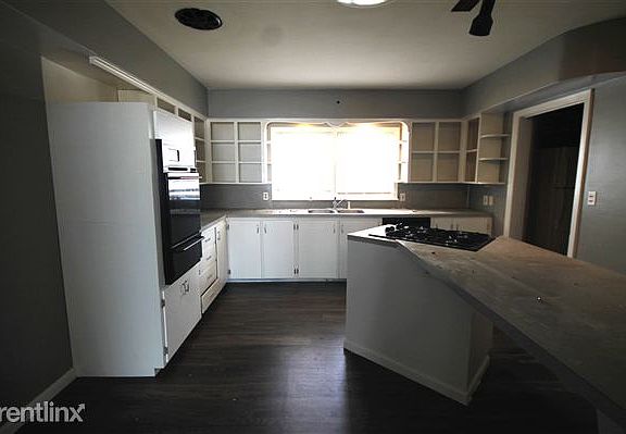 VIEW OF KITCHEN FROM LIVING ROOM