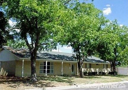 A Shaded Beauty : Four mature pecan trees shade the house from the afternoon sun.