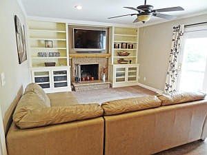 Family Room Features Custom Built in Cab