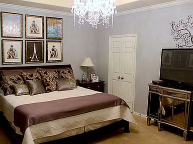 THIS LUXURIOUS MASTER BEDROOM WITH CUSTOM DESIGNER CARPET AND CRYSTAL CHANDELIER. OFFERS A WONDERFUL RETREAT FROM YOUR DAY