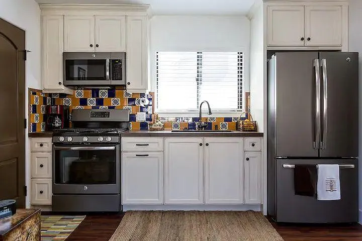 Full kitchen in the Murphy bedroom, with a bathroom and shower, and a family room area.