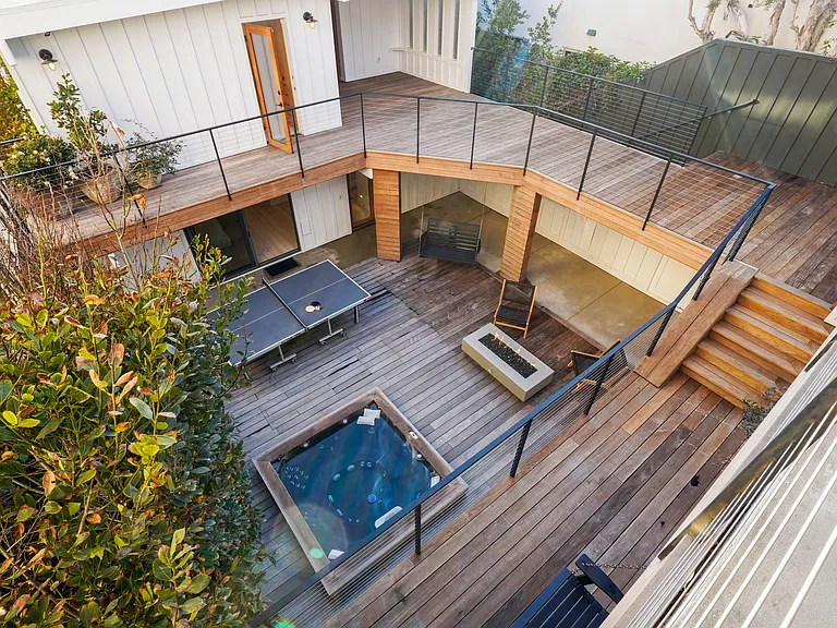 Expansive outdoor spaces seamlessly link multiple levels of the home.