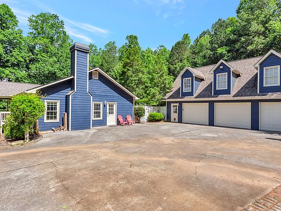 Driveway can fit 4-5 vehicles. Very large.