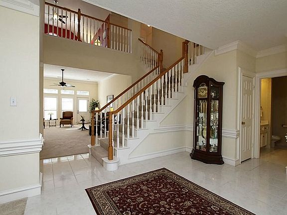 Grand entry opens to family room with study to the right and dining room to the left