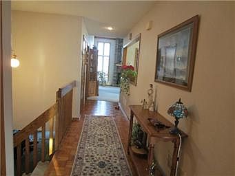 Spacious great room with soaring brick fireplace.