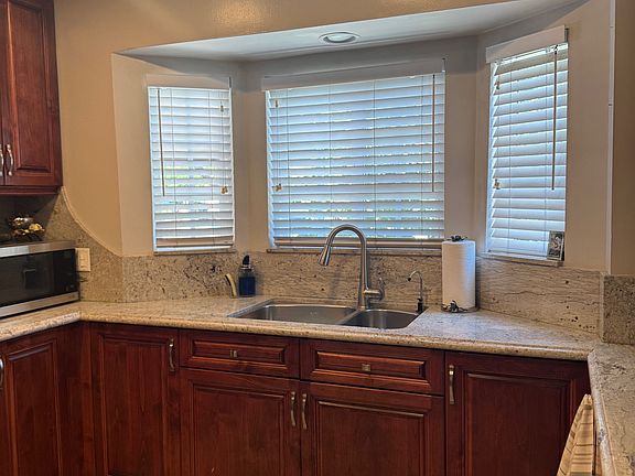 Kitchen sink with windows overseeing garden