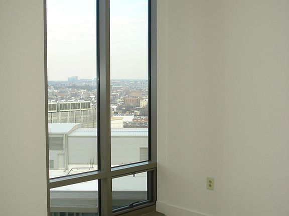 Oversized Floor to Ceiling Window in Master Bedroom