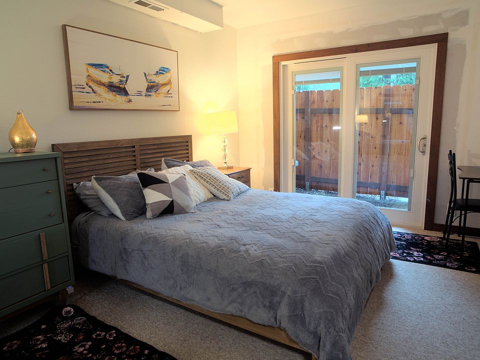 Downstairs bedroom 'Simply Suite,' with private entrance and outdoor sitting area.