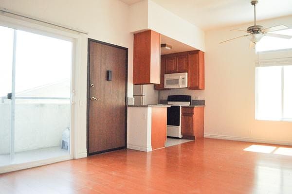 Living Room + Open Kitchen and dining area. Open patio outdoors
