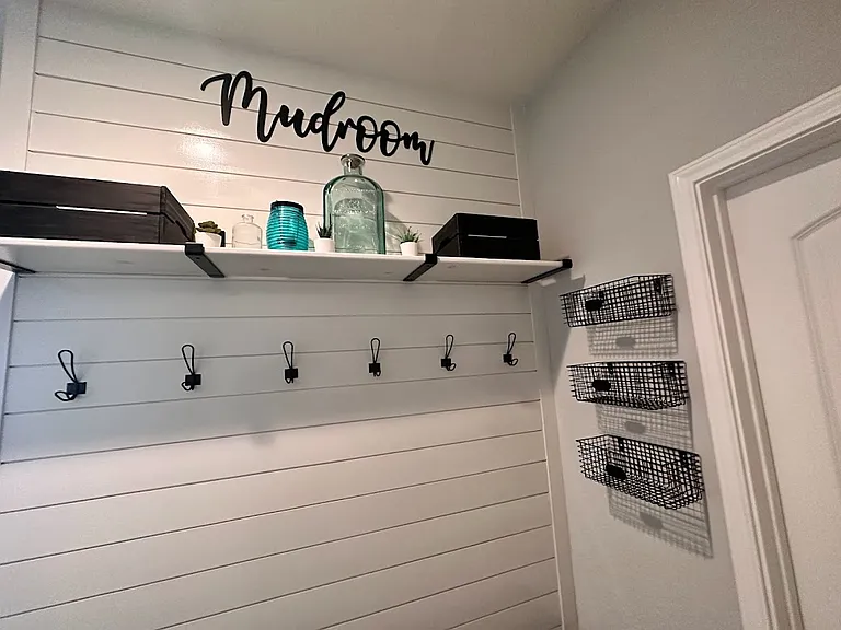 Mudroom off garage with an additional storage closet
