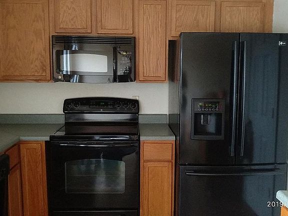 Kitchen with 5 range glass top stove, microwave, fridge and dishwasher included.