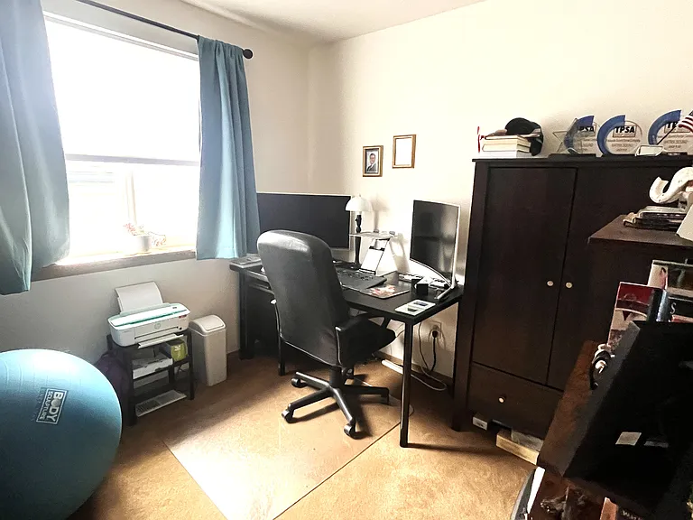 Third Bedroom / Home Office: Currently styled as a productive workspace, this bright third bedroom offers the perfect flexibility to remain a dedicated home office or easily transition back into a full bedroom.