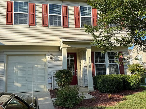 Note the large front and side yard - it's an end unit townhome.