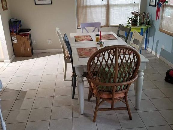 Dinning area next to kitchen/ living room to right door to pool.