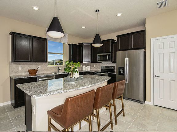 Kitchen with Island for Meal Planning at Home or Entertaining with Friends