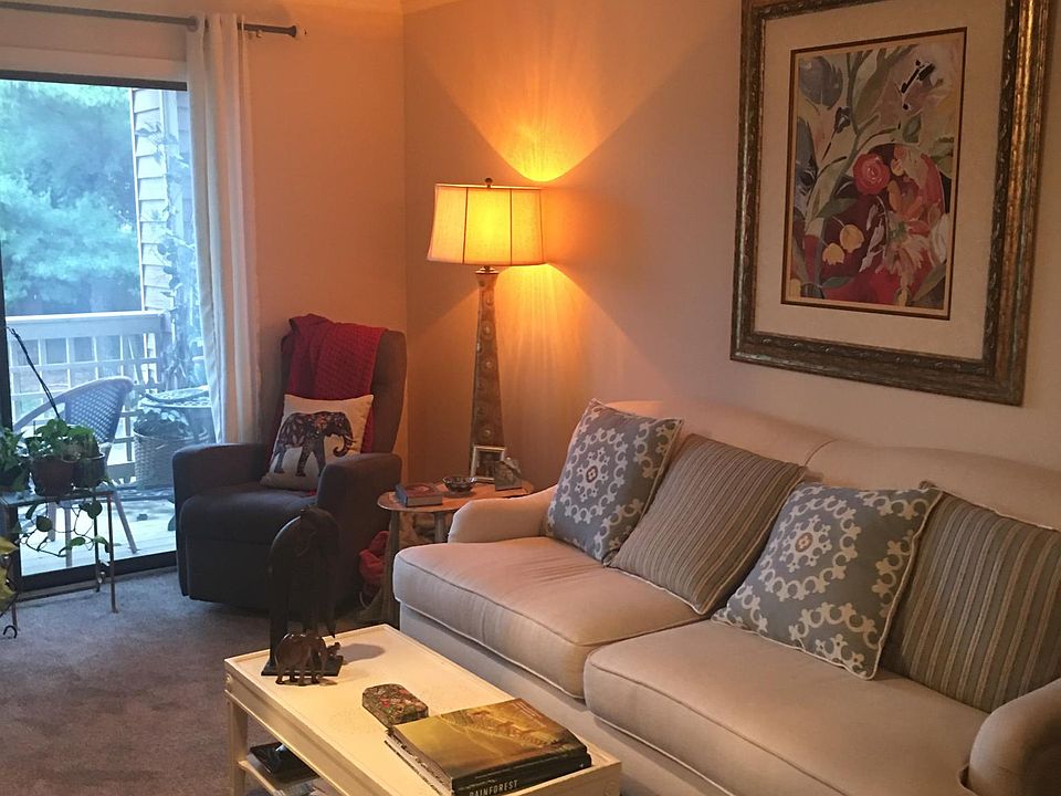 Living room with fireplace and adjoining dining room