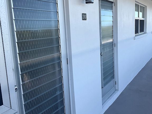 Side be side kitchen and front entryways.