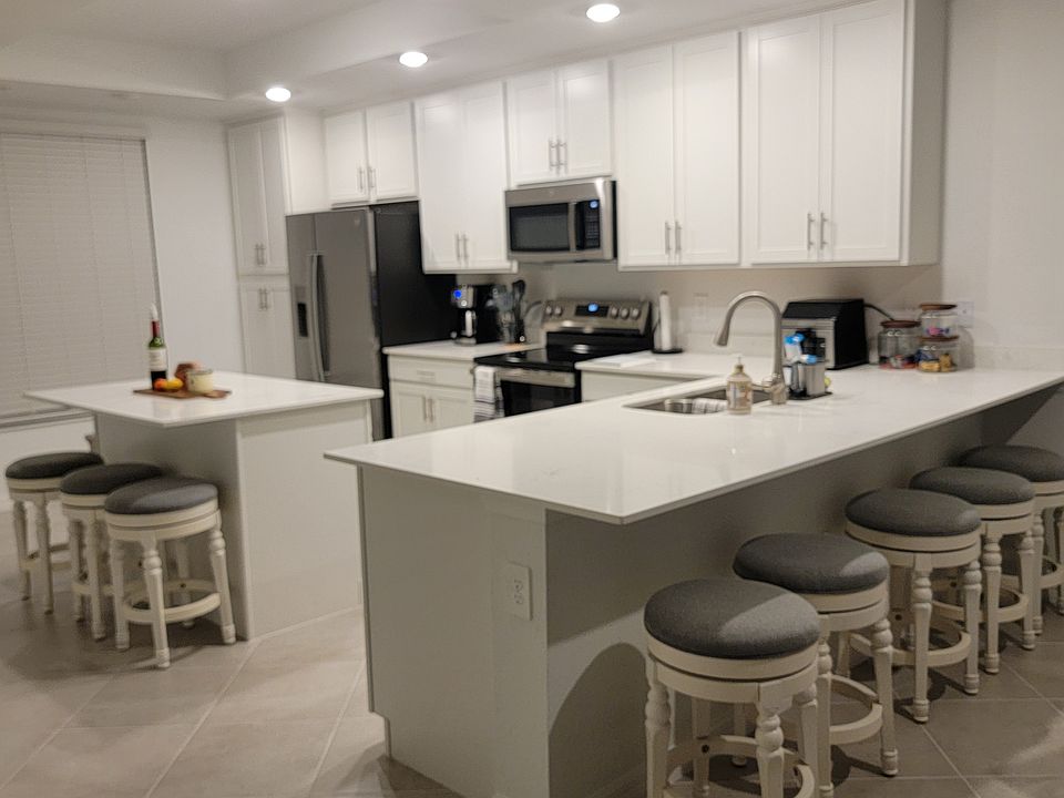 Fully stocked kitchen with upgraded stainless steel appliances