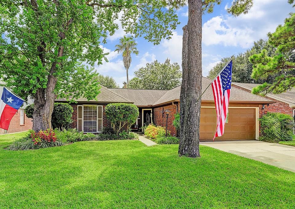 Welcome home to this inviting 3-bedroom, 2-bathroom home with 2-car attached garage with double driveway. Notice the mature trees, lush landscaping, decorative exterior shutters and gutters