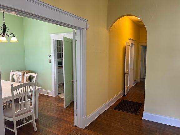 looking into kitchen from den and hallway. by front door