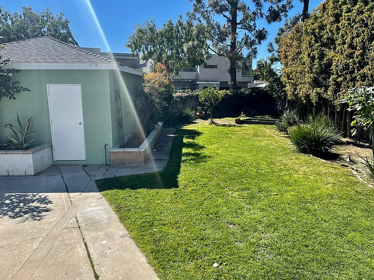 Spacious backyard with detached garage