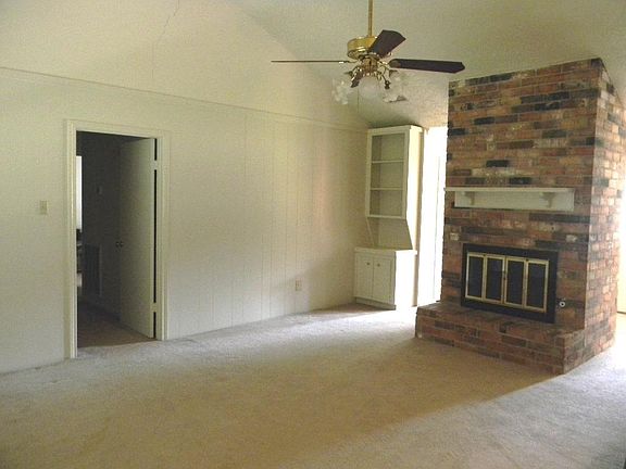 This is a wonderful family room with fireplace that is attached thru a bar to the breakfast and kitchen