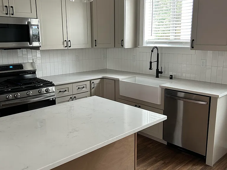 Kitchen - Farm Sink, Gas stove, pendant lighting, tiled backsplash