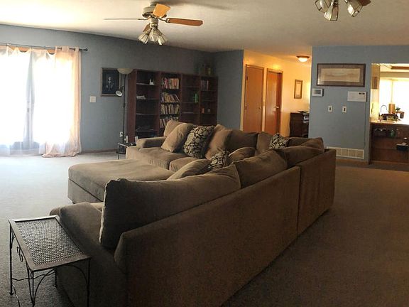 Living Room _ 61_ Flat screen television _ Homework Desk _ 4 Bookshelves _ Wood burning fireplace _ Wall to Wall Carpet