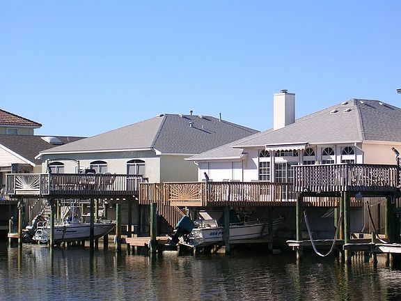 East facing Large canal Home on right