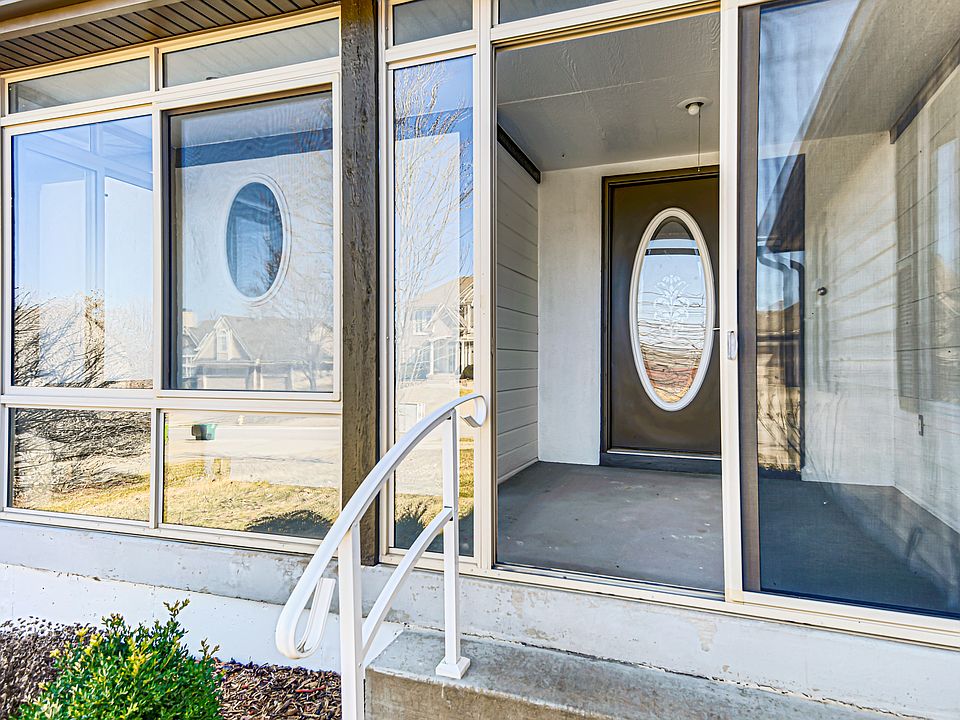 Atrium-style front entry with circulating heat/cool system and screened windows for year round use. Coffee drinker's delight!