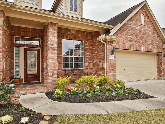 This impressive front elevation is adorned with a beautiful landscape both front and back!