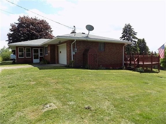 The side view shows the front entrance and deck in back.