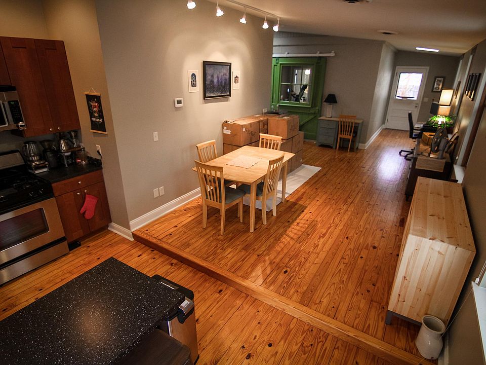 From entry, living area wraps around wall on left