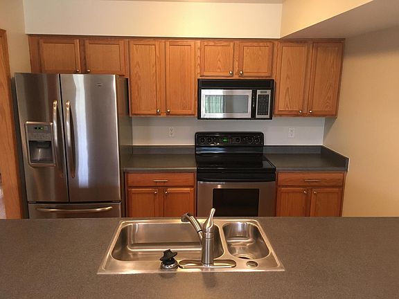 Kitchen with refrigerator, oven, microwave, and dishwasher