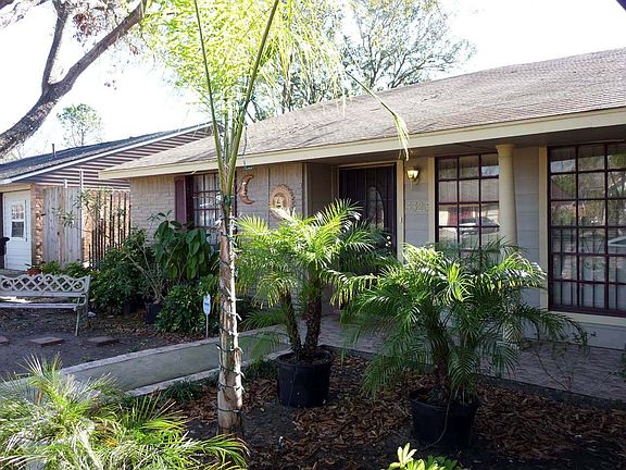 Home features custom tiled sidewalk and Patio,